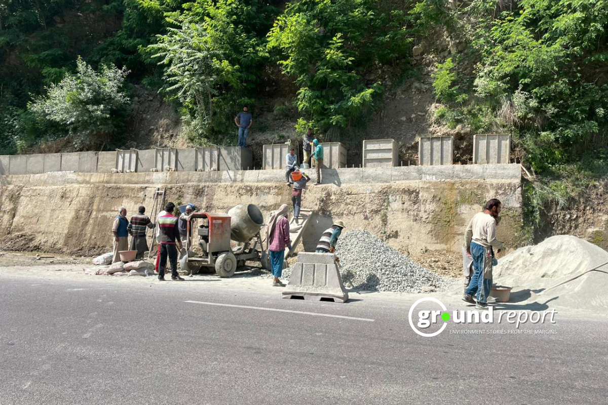 Workers carry out road widening work in the Himalayan stretch under the Char Dham project, a move now facing fresh calls for review.