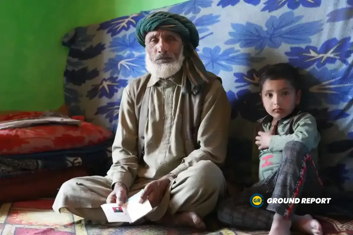 Abdul Rashid Khatana, sitting beside his grandson, with his wife’s identification card | Photo Credit: Rajeev Tyagi