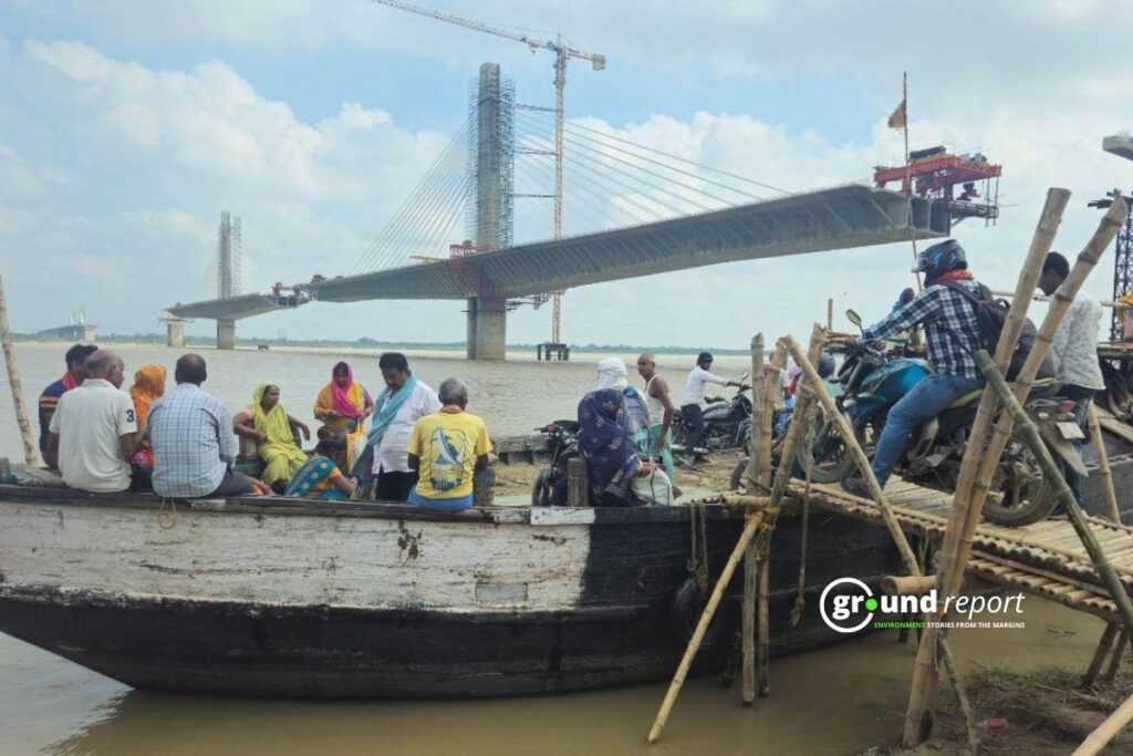 Locals take a boat to cross the Ganga river as the bridge is still under construction. Photo Credit: Sumit Singh for Ground Report