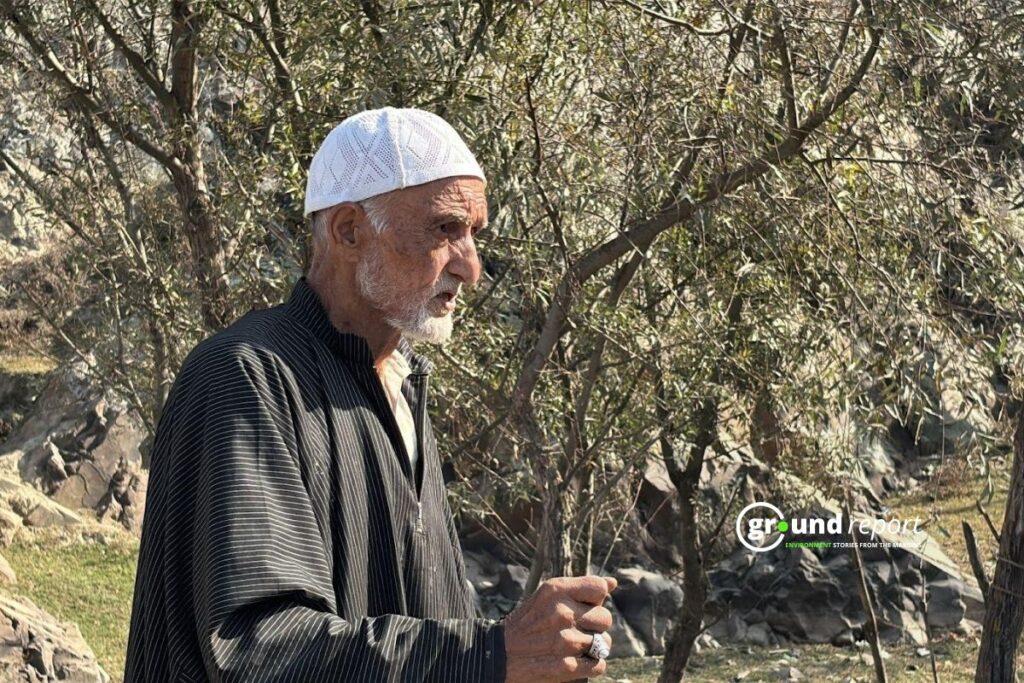 Wahab Mohammad Dar shares his concerns about the shrinking Wular Lake and its impact on livelihoods. Photo credit: Ground Report