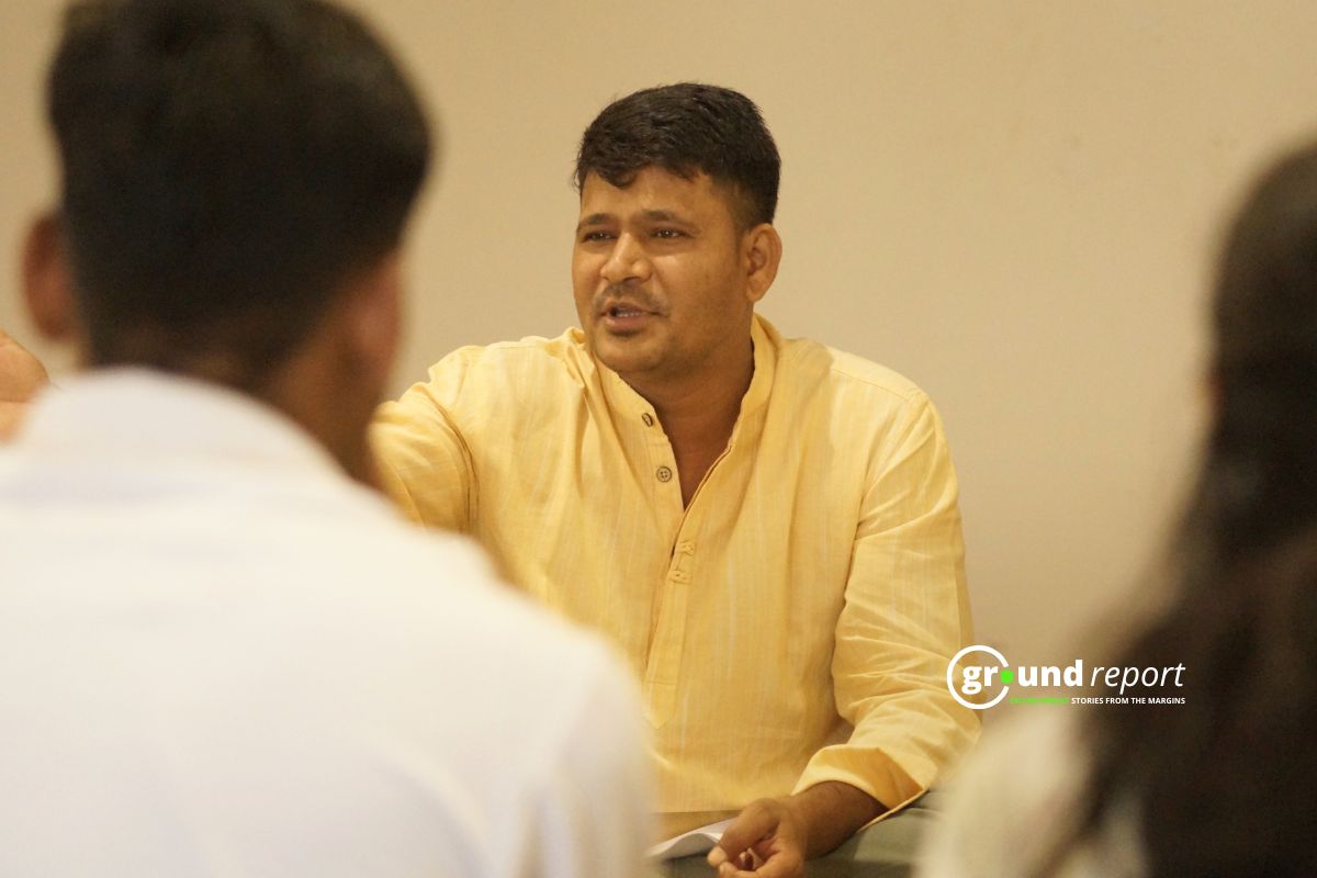 Manish Dangi speaks at an awareness session in Rajgarh.