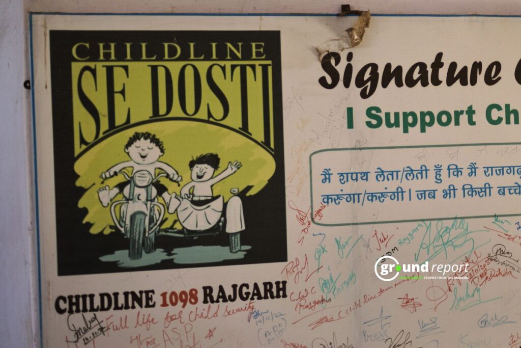 A Childline pledge board at the Rajgarh office calls for child protection.