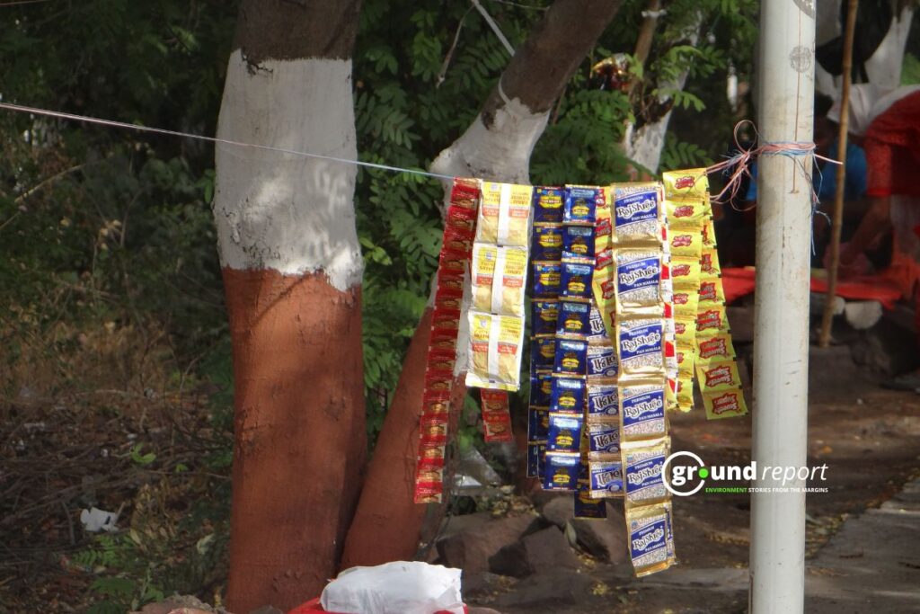 Pan masala and gutkha sachets hang at a roadside stall in Madhya Pradesh — banned by law, sold in plain sight.