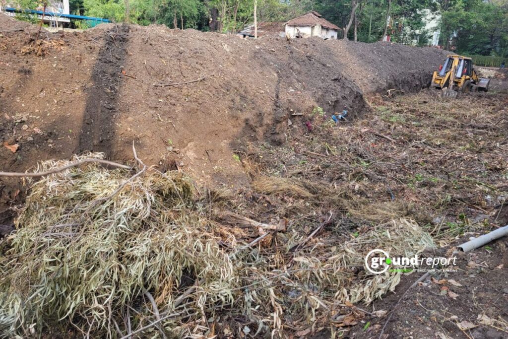 A JCB excavates the soil at SGSITS, Indore, as part of the ground preparation for the Miyawaki forest.