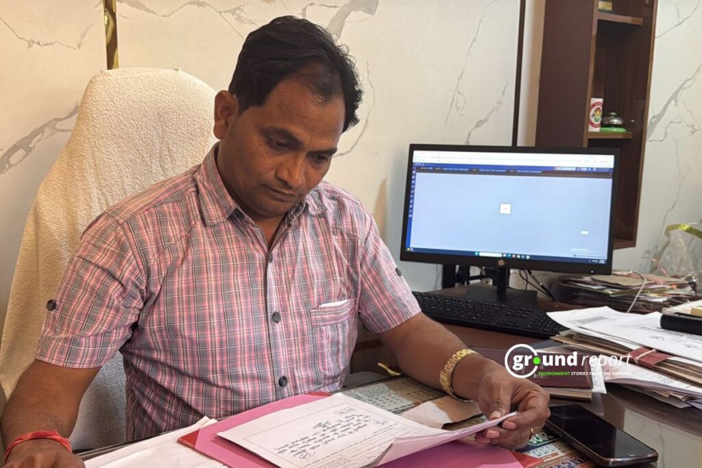 Shyam Babu Khare reviews district malnutrition data at the Rajgarh Collectorate.