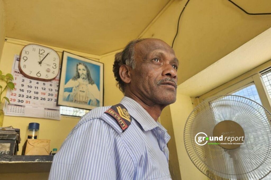 K. Prakash, a security guard in Bengaluru, sits inside his cabin during an afternoon shift.
