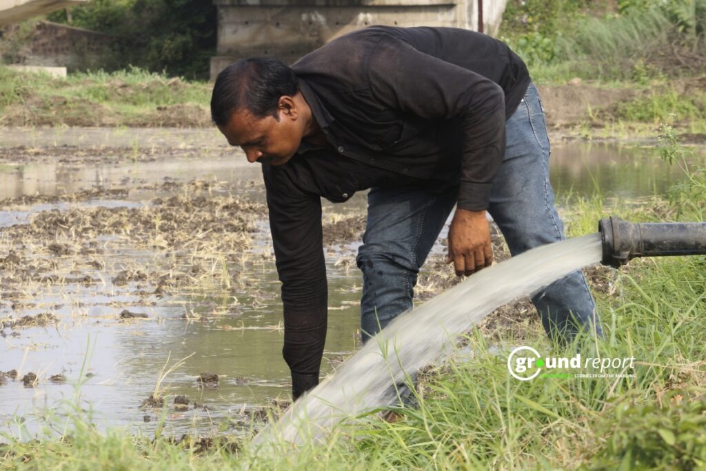Farmer Kailash Vishwakarma irrigating his field with a borewell, Khajuri Sadak village.
