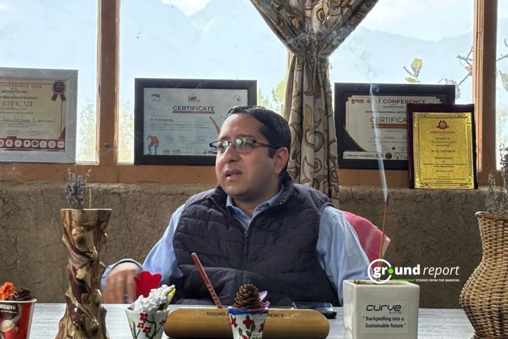 Advocate Nadeem Qadri speaks about his legal fight to protect the hangul habitat, surrounded by certificates and awards for environmental conservation.  