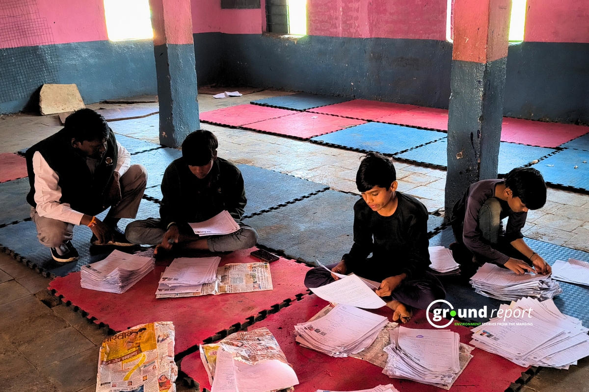Class 10 students helping BLO Mangilal Verma in SIR work on Sunday holiday, Dhanvasa village, Rajgarh