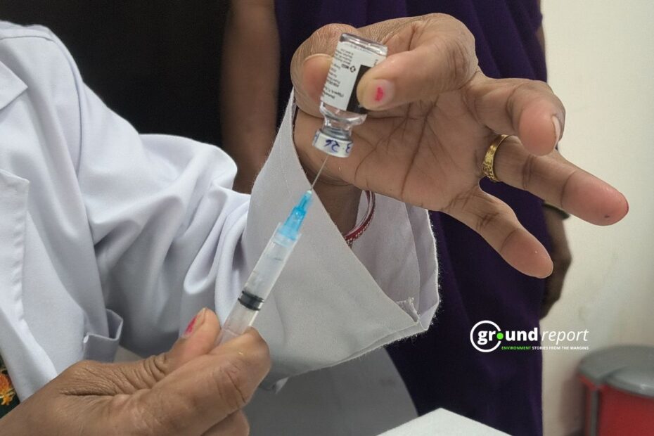 ANM Rekha Dwivedi vaccinating another girl with the HPV vaccine at Rajgarh District Hospital,