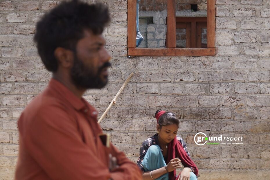 Varsha Beldar is sitting outside his half-built house in a village 50 kms away from Rajgarh.